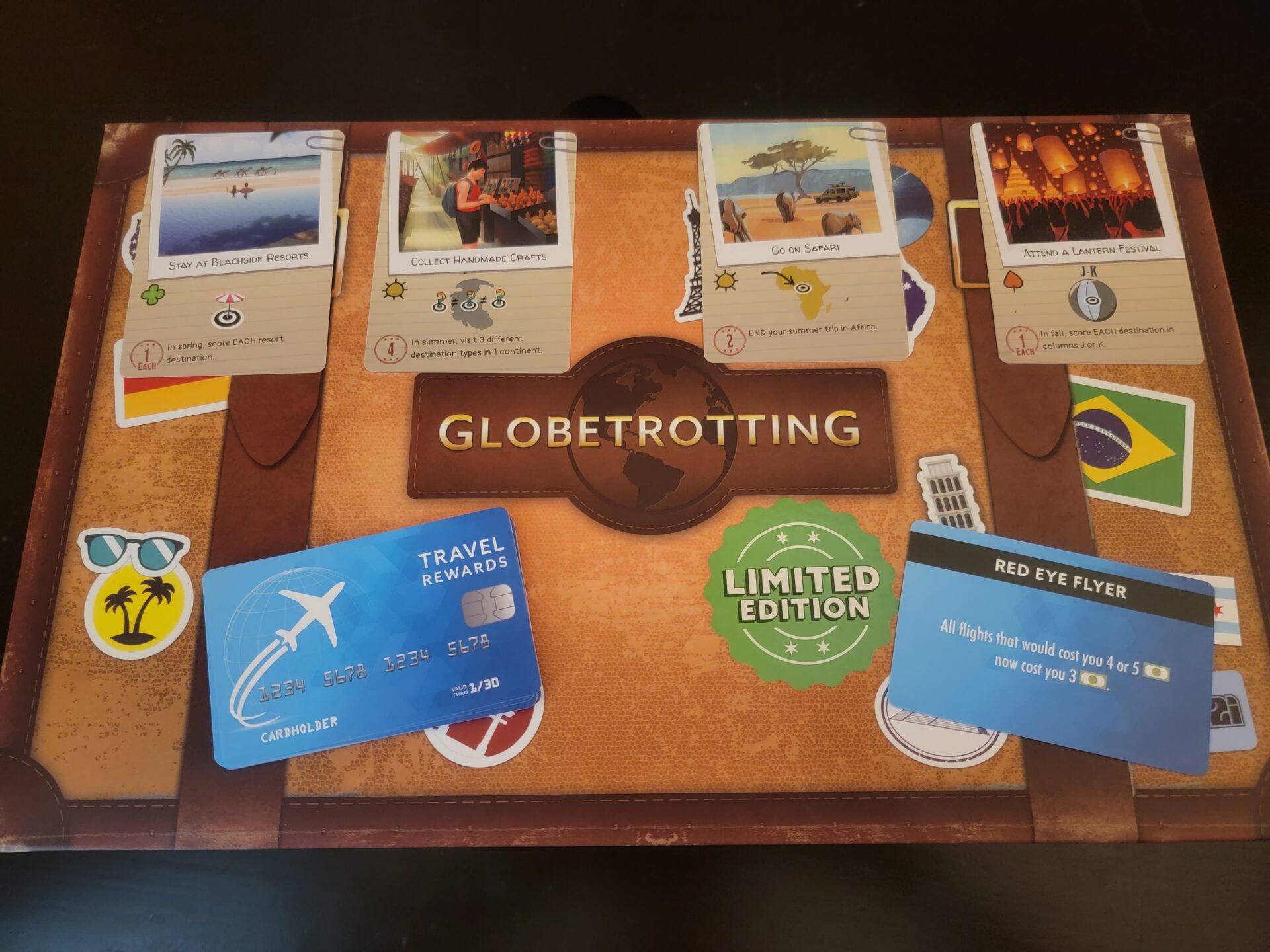 Globetrotting board game box on a table.